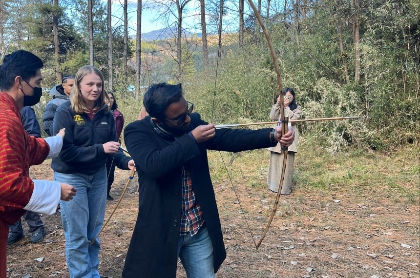 Students participate in a traditional archery session in Bhutan