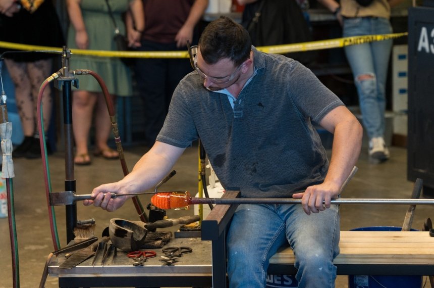 Travis Adams '14 during a hot glass demonstration at Centre Homecoming 2024