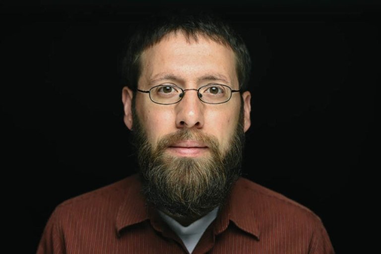 Person wearing glasses smiling 