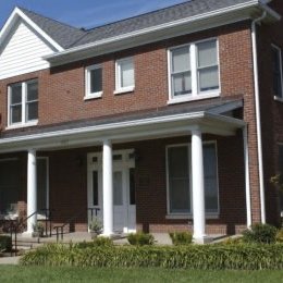 Two story home with multi size windows on second story. Brick home.