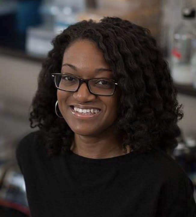 Person wearing glasses smiling 