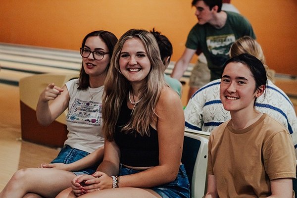 Bonner group photo at bowling ally at event