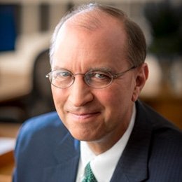 Person wearing suit smiling 