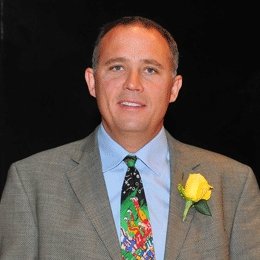 Person wearing suit smiling 