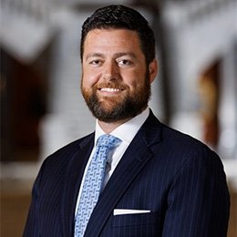 Person wearing suit smiling 