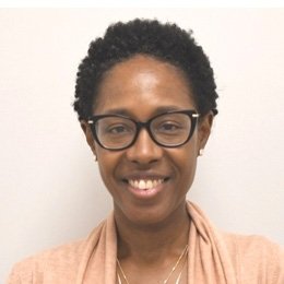 Person wearing glasses smiling 