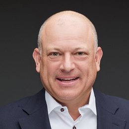 Person wearing suit smiling 