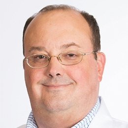 Person wearing glasses smiling 