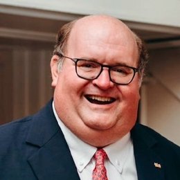 Person wearing glasses and smiling 