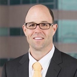 Man wearing glasses and smiling 