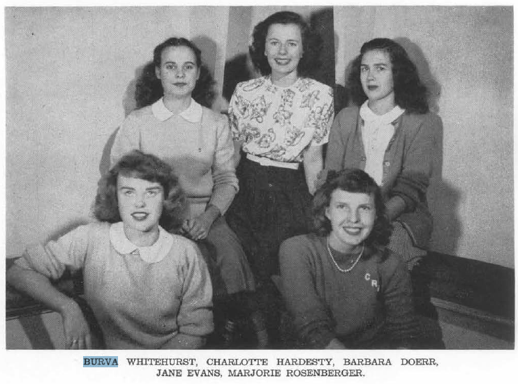 A black and white photo fromthe 1940s shows five women posing together for a photo. 