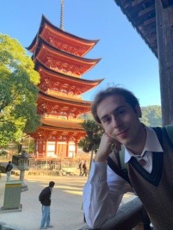 Tyler Kinney in front of a pagoda in Japan.