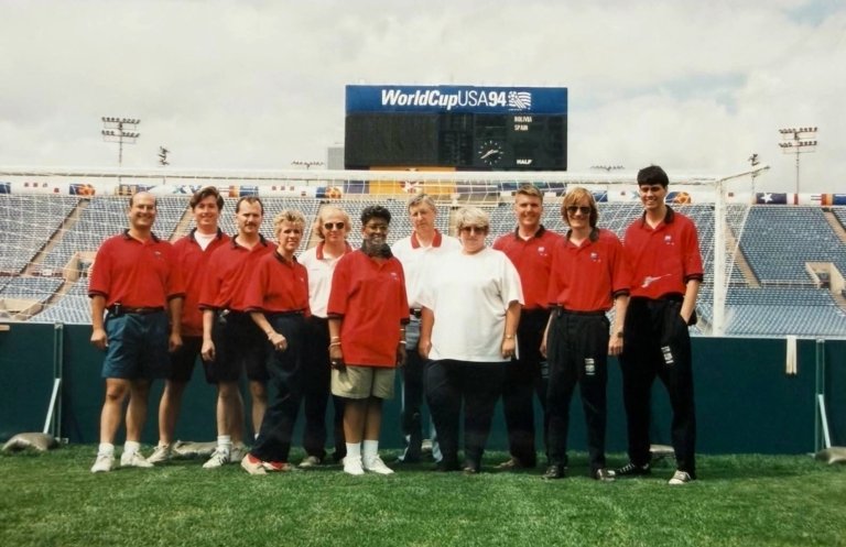 Dave standing on the field with his coworkers on FIFA World Cup ’94.