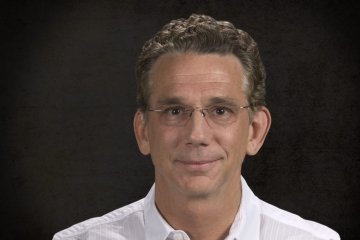 Person wearing glasses smiling 