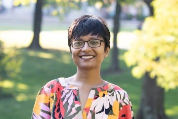 Person wearing glasses smiling 