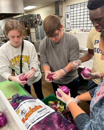 Centre College students prepare soup for Soup's On Us, a local non-profit.