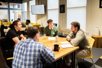 Students and community members discussed research about early childhood education at CentreWorks.