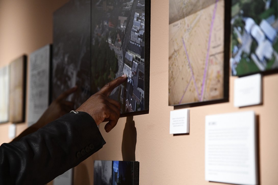 People viewing "We Were Here" exhibit