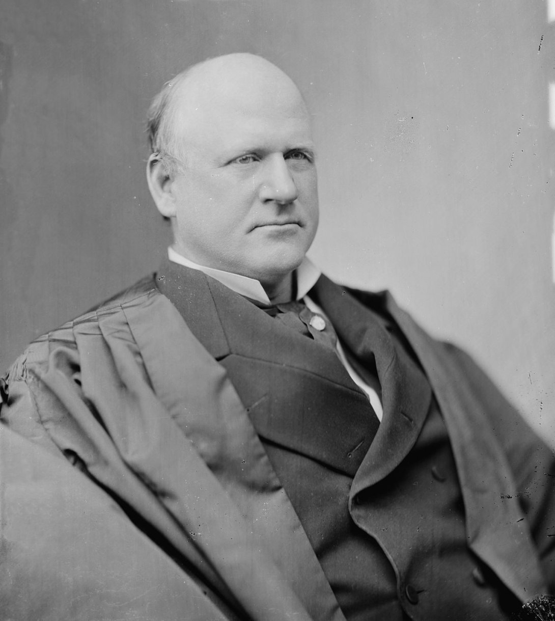 A black and white portrait of Justice John Marshall Harlan