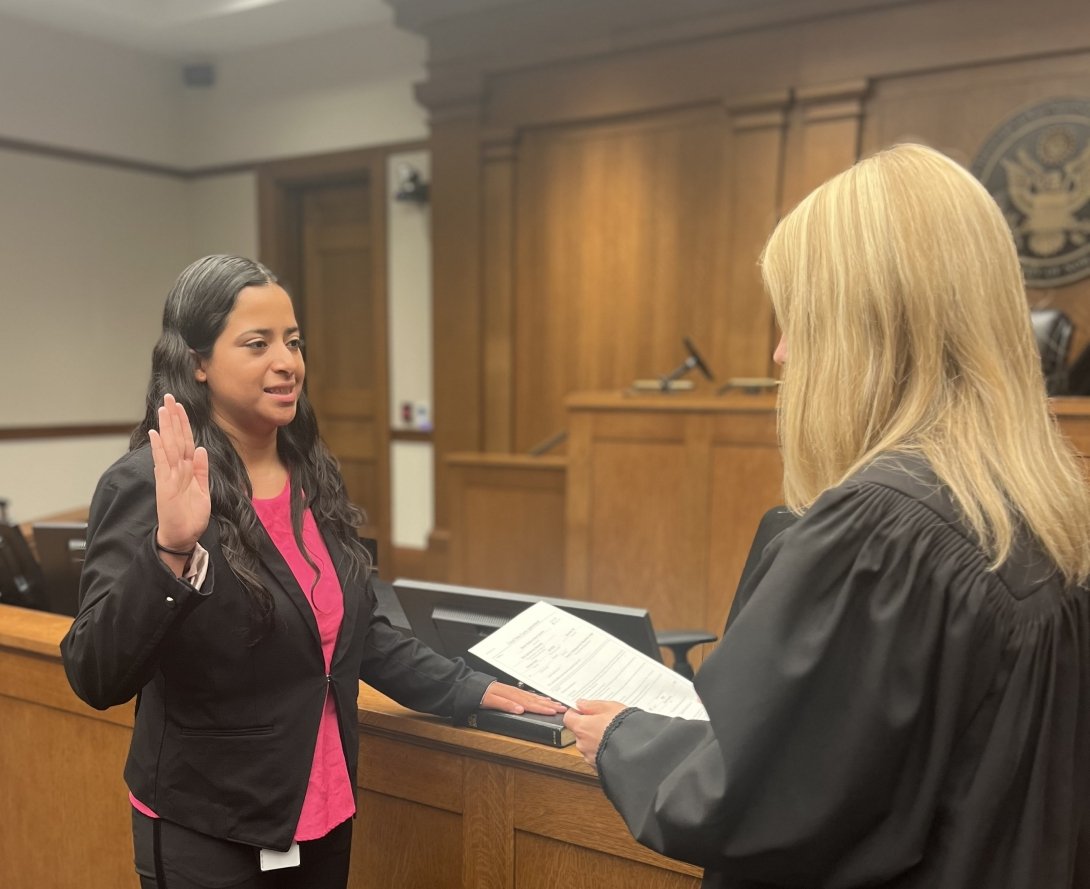 Maria Sanchez being sworn in by Susan Rodriguez.
