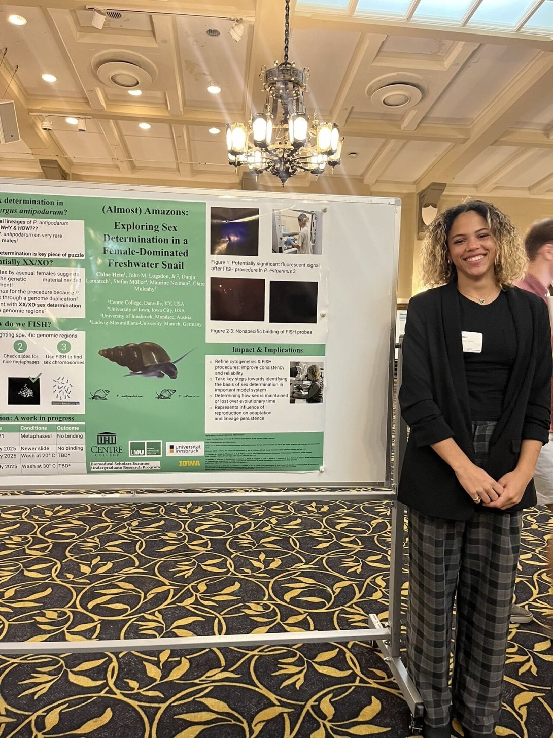 Chloe Hein presenting on her research at the Summer Undergraduate Research Conference.