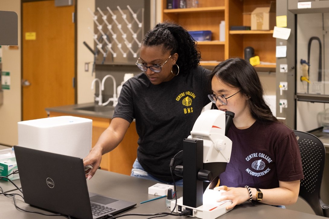 Genevive Bell and Remy Bao conduct research and examine their results in the lab.