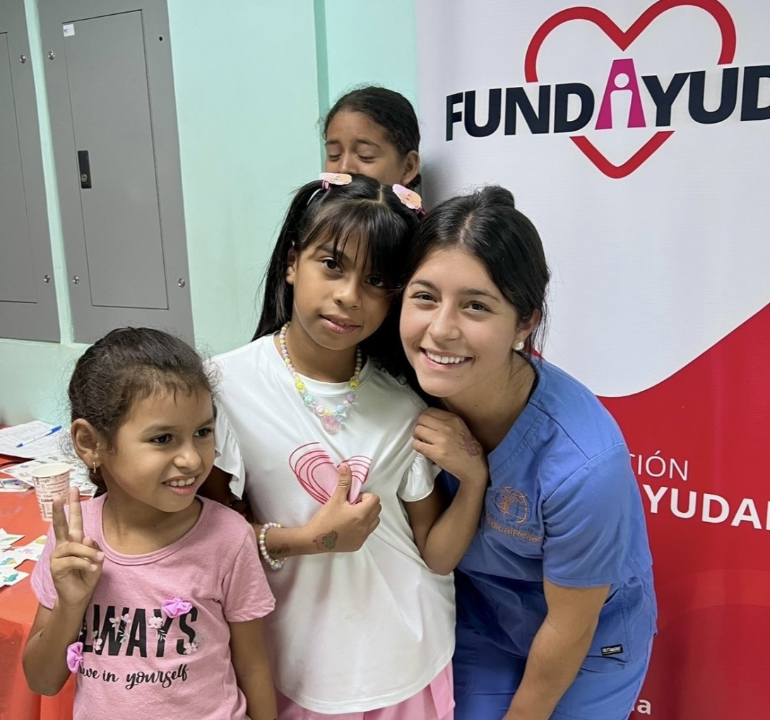 Nicole Limehouse with two of the children she helped treat.